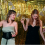 Women at a party with bouncy, glamorous curls, showing how a heatless hair curler creates party-ready styles.